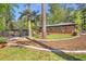 Spacious backyard with a patio featuring mature trees and landscaping at 3385 Pinehill Dr, Decatur, GA 30032