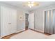 Comfortable bedroom with closet, ceiling fan, and hardwood floors at 3385 Pinehill Dr, Decatur, GA 30032