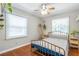Bedroom features hardwood floors, ceiling fan, and natural light at 3385 Pinehill Dr, Decatur, GA 30032