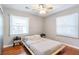 Bright bedroom with hardwood floors, ceiling fan, and neutral colors at 3385 Pinehill Dr, Decatur, GA 30032