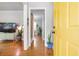 Bright entryway showcasing hardwood floors, a vibrant yellow door, and stylish decor, creating a warm welcome at 3385 Pinehill Dr, Decatur, GA 30032