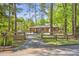Charming brick home featuring a welcoming driveway and mature trees, creating a serene and private setting at 3385 Pinehill Dr, Decatur, GA 30032
