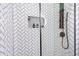 The sleek shower features white tiles with black grout in a herringbone pattern and black hardware at 3385 Pinehill Dr, Decatur, GA 30032