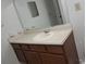 Bathroom vanity features a sink, mirror, and cabinet storage at 340 Teal Ct, Roswell, GA 30076