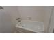 Clean white tub with tiled walls in the bathroom at 340 Teal Ct, Roswell, GA 30076