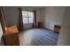 Clean bedroom with neutral walls, wood-look flooring, and two dressers at 340 Teal Ct, Roswell, GA 30076