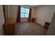 Bedroom showcasing a large window with curtains and wood-look flooring at 340 Teal Ct, Roswell, GA 30076