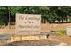 Community sign for The Landings Martin Lakes Townhomes & Condominiums at 340 Teal Ct, Roswell, GA 30076