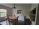 Inviting dining area featuring a wooden table, chandelier, and a view to the outside at 340 Teal Ct, Roswell, GA 30076