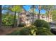 Charming condo with brick and vinyl siding, surrounded by lush greenery and mature trees at 340 Teal Ct, Roswell, GA 30076