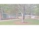 Enjoy a scenic view of the lake from the walking path, complete with lush trees and a serene atmosphere at 340 Teal Ct, Roswell, GA 30076