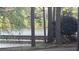 Picturesque lake view featuring a pier and tranquil water at 340 Teal Ct, Roswell, GA 30076