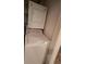 White stacked washer and dryer appliances ready for laundry day at 340 Teal Ct, Roswell, GA 30076