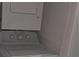 Stacked white washer and dryer unit at 340 Teal Ct, Roswell, GA 30076