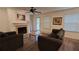 Inviting living room with a cozy fireplace, wood-look floors, and ample natural light at 340 Teal Ct, Roswell, GA 30076