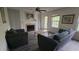 Cozy living room with neutral walls, a fireplace, and access to the outdoors at 340 Teal Ct, Roswell, GA 30076