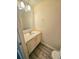 Bathroom with single sink, toilet, and towel rack at 1557 Springleaf Se Ct, Smyrna, GA 30080