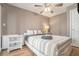 Comfortable bedroom with natural light, ceiling fan, and a white nightstand at 215 Piedmont Ne Ave # 2003, Atlanta, GA 30308