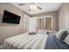 Bedroom with natural light, ceiling fan, mounted TV, and sliding doors to balcony at 215 Piedmont Ne Ave # 2003, Atlanta, GA 30308