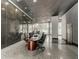 Contemporary conference room featuring modern table and chairs, marble wall, and natural light at 215 Piedmont Ne Ave # 2003, Atlanta, GA 30308