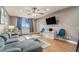 Well-lit living room with plush seating, modern decor, and a large flat-screen television for entertainment at 215 Piedmont Ne Ave # 2003, Atlanta, GA 30308