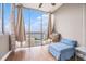 Bright sitting area with floor-to-ceiling windows offering panoramic city views and ample natural light at 215 Piedmont Ne Ave # 2003, Atlanta, GA 30308