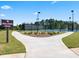 Well-maintained walking trail next to the tennis courts with manicured landscaping and signage at 3740 Near Star Ln, Cumming, GA 30028