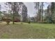 Large backyard showcasing the home's exterior with a red deck at 1245 Shore Dr, Atlanta, GA 30311