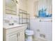 Neat bathroom with a large mirror, cabinet, and bright lighting at 1245 Shore Dr, Atlanta, GA 30311