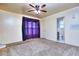 Spacious bedroom with plush carpeting, ceiling fan, and access to an ensuite bathroom at 1245 Shore Dr, Atlanta, GA 30311