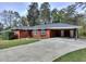 Classic brick home with a convenient carport and inviting curb appeal at 1245 Shore Dr, Atlanta, GA 30311