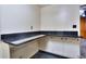 Kitchen features a built-in counter and white cabinetry at 1245 Shore Dr, Atlanta, GA 30311