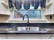 A stainless steel double basin sink sits below a window, providing natural light and pleasant views at 1245 Shore Dr, Atlanta, GA 30311