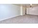 A expansive living area featuring carpet and white walls at 1245 Shore Dr, Atlanta, GA 30311