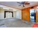 Spacious living room featuring skylights, wood paneling, and an open view to the kitchen at 1245 Shore Dr, Atlanta, GA 30311