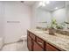 Bathroom with granite countertops, updated cabinets, and white tile floor and backsplash at 306 Teal Ct, Roswell, GA 30076
