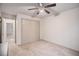 Neutral bedroom with carpet flooring, a ceiling fan, and a large closet with sliding doors at 306 Teal Ct, Roswell, GA 30076