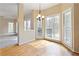 Breakfast area with a chandelier and large windows overlooking an outdoor deck and wooded backyard at 540 Basil Sw Ct, Marietta, GA 30064