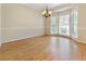Bright dining area with hardwood floors, bay windows, and a chandelier at 540 Basil Sw Ct, Marietta, GA 30064