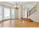 An open-concept dining room with hardwood floors and large windows at 540 Basil Sw Ct, Marietta, GA 30064