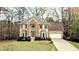 Charming two-story home with a combination of stone and siding, bay windows, and a well-manicured front lawn at 540 Basil Sw Ct, Marietta, GA 30064