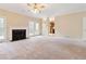 Living room featuring neutral carpet, fireplace and a view into the kitchen and back deck at 540 Basil Sw Ct, Marietta, GA 30064