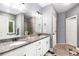 Spacious bathroom featuring granite countertops and a dual sink vanity at 95 Hawthorn Ln, Covington, GA 30014