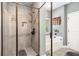 Modern bathroom features a tiled shower and a separate bathtub with a window at 95 Hawthorn Ln, Covington, GA 30014