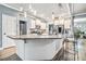 Eat-in kitchen features granite countertops, pendant lighting, and modern appliances at 95 Hawthorn Ln, Covington, GA 30014