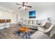 Inviting living room features a neutral sofa, stylish accent chairs, and a ceiling fan for comfortable living at 215 Piedmont Ne Ave # 708, Atlanta, GA 30308