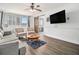 Cozy living room featuring comfortable seating, a ceiling fan, and natural light from the window at 215 Piedmont Ne Ave # 708, Atlanta, GA 30308