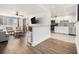 Inviting living room featuring hardwood floors, ceiling fan, and a breakfast bar open to the kitchen at 215 Piedmont Ne Ave # 708, Atlanta, GA 30308