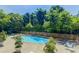 Community pool surrounded by lush greenery, offering a relaxing oasis for residents at 215 Piedmont Ne Ave # 708, Atlanta, GA 30308