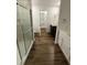 Bright bathroom with walk-in shower, vanity, and modern wood-look flooring at 2523 Hood Nw Ave, Atlanta, GA 30318